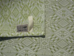 Strofinaccio, tessitura artigianale in misto lino/cotone, con disegno Biscotto salentino di colore verde muschio